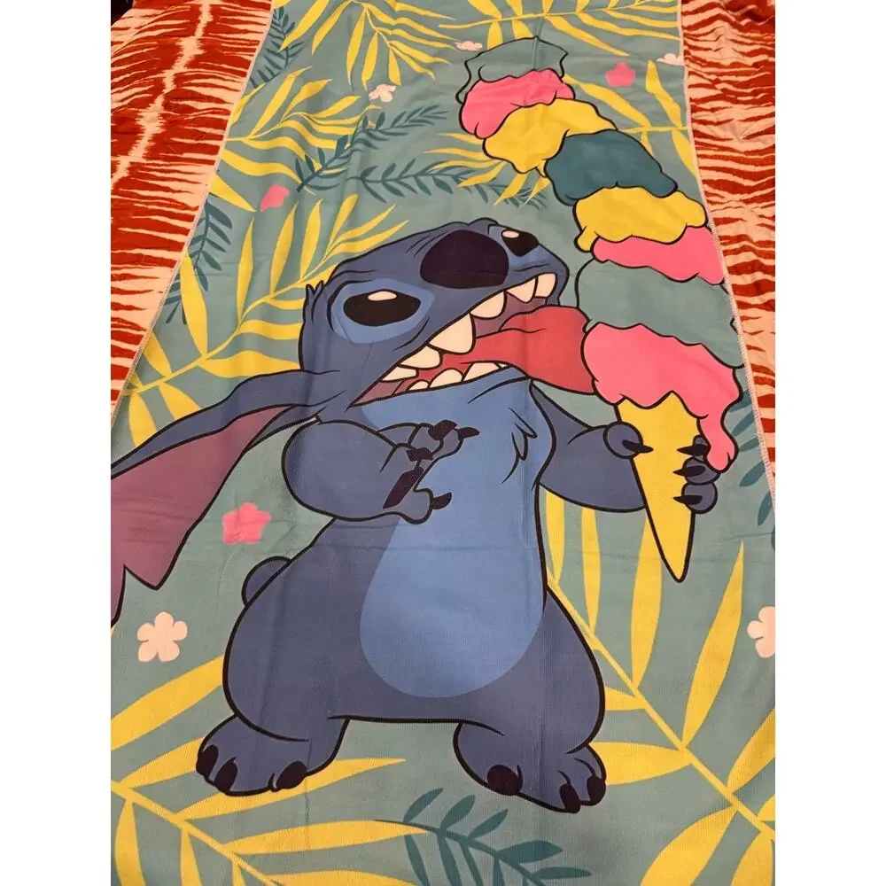 Stitch beach towel with Stitch holding a multi-colored ice cream palm leaves